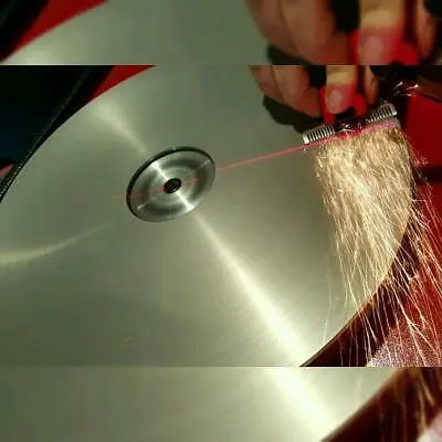 Sharpening a clipper blade on Big Red machine