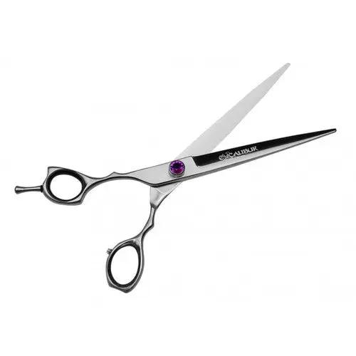 A pair of doge grooming scissors on a white background