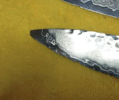 A Knife with a broken tip on yellow background