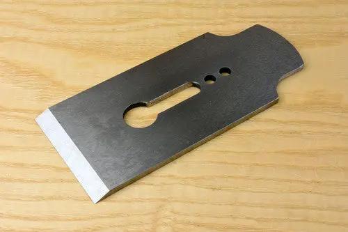 Plain iron on wooden table